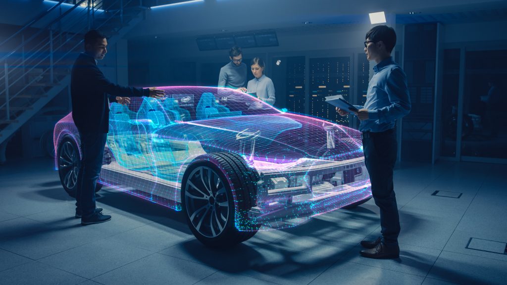 Group of Automobile Design Engineers Working on Augmented Reality 3D Model Prototype of Electric Car Chassis. Automotive Innovation Facility: 3D Concept Vehicle Frame Generated with 3D CAD Software.