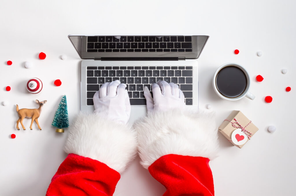 Holiday online shopping theme with laptop ecommerce development