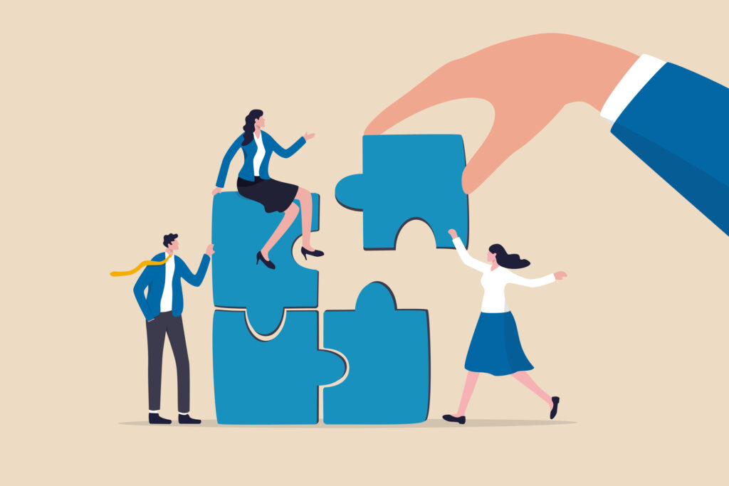 Build your team, leadership to develop teamwork or business partner, cooperate or collaborate for success, assist or help, giant businessman hand connect last jigsaw puzzle to office business team. teamwork and trust make software a success